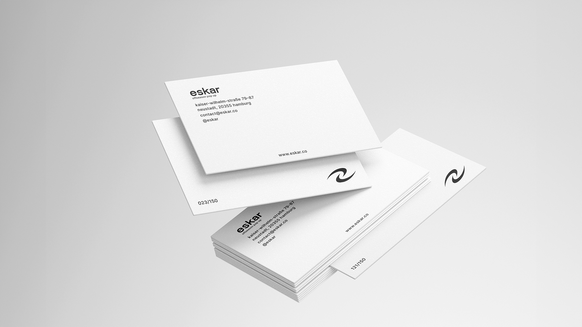 Business card mockup showing minimalist design with eskar logo